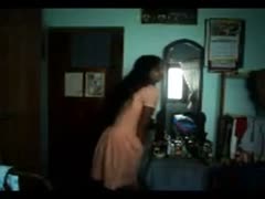 In her bedroom, a petite Desi sweetie of legal age stripteases on livecam.